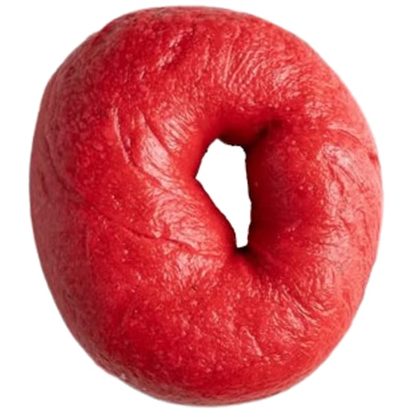 A vibrant red Ugly Bagel, perfectly round with a distinct hole in the center, against a white background.