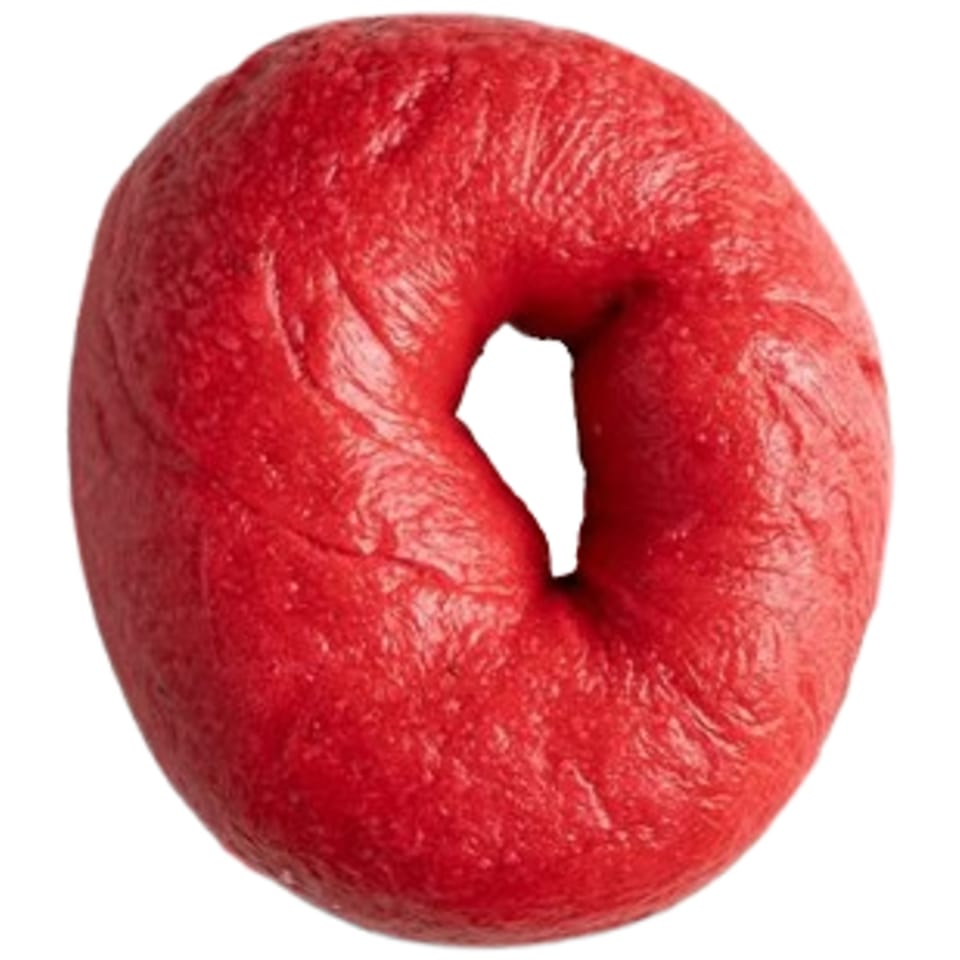 A vibrant red Ugly Bagel, perfectly round with a distinct hole in the center, against a white background.